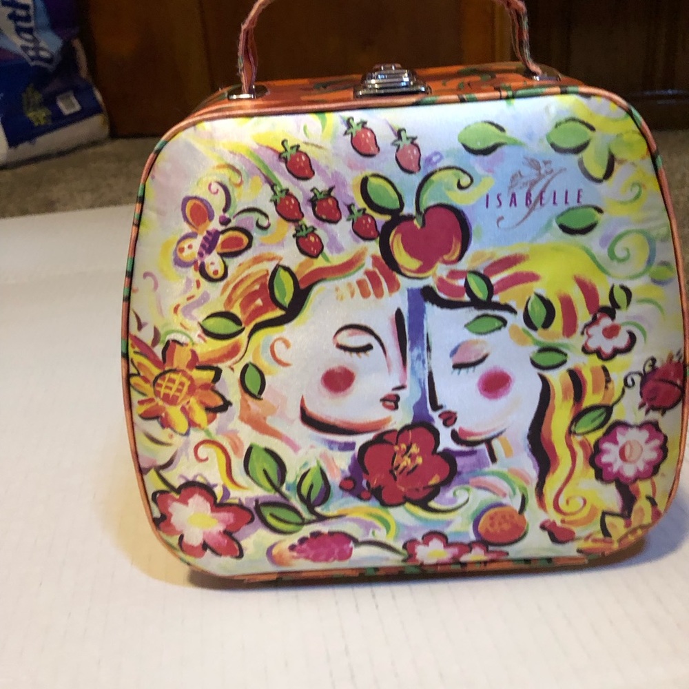 Isabelle- Make up case with mirror or a fun purse.